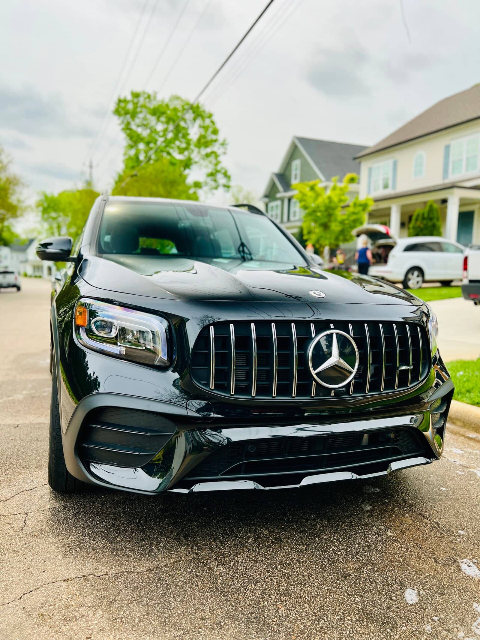 Black Mercedes-AMG GLB detailed on a residential driveway